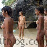 four naked girls at the beach