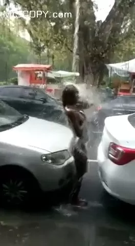 Video Woman Bathing Naked in the Street