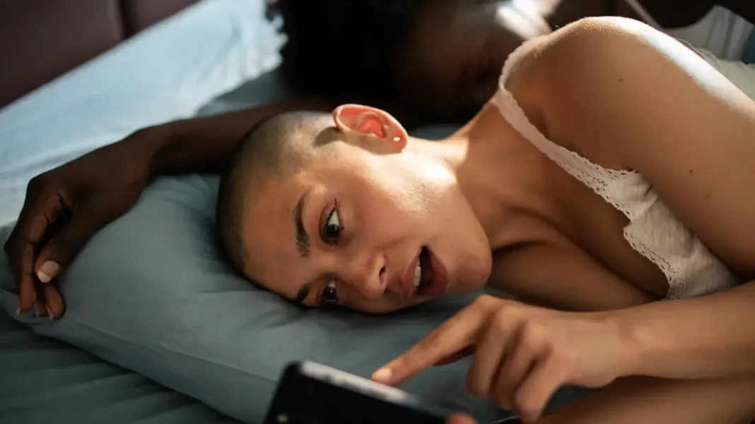 Cheating Girlfriend on the phone while her partner is next to her
