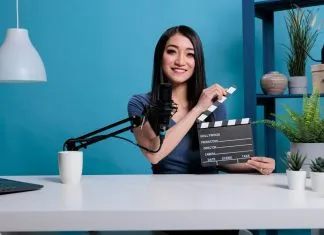 movie-director-clapping-film-slate-in-front-of-cam