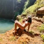 Sitting on a rock naked by the river pic